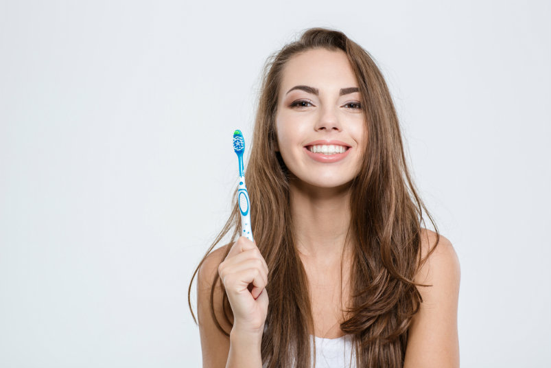 girl choosing toothbrush - dental care