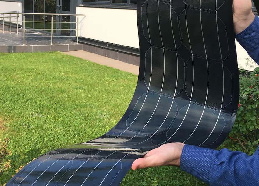 man holding thin film solar cells