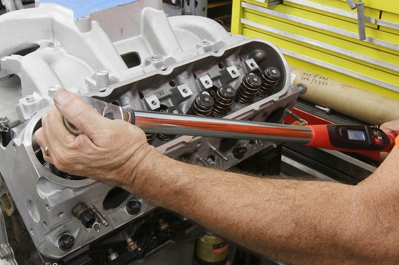 removing nuts and bolts from engine 