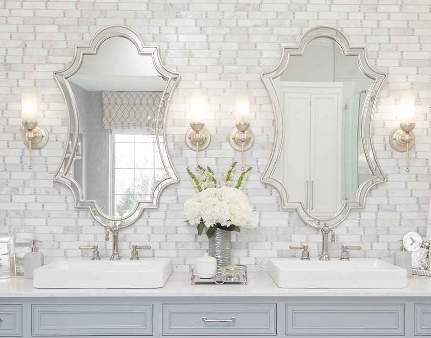 two elegant mirrors in bathroom