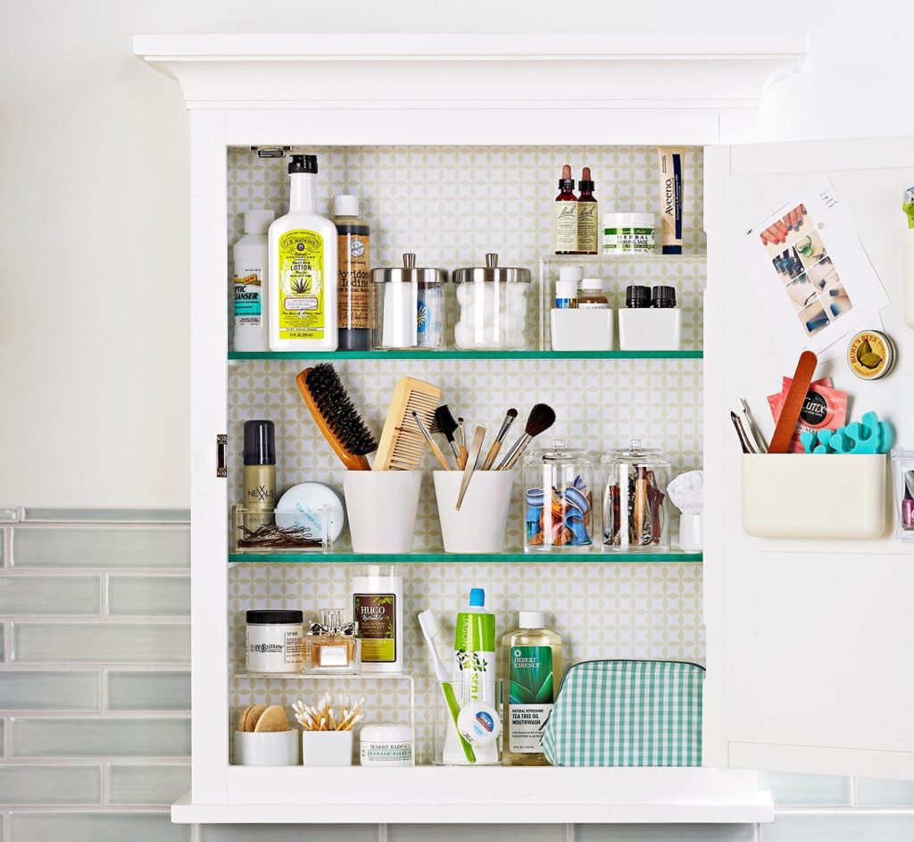 organized cupboard in bathroom 