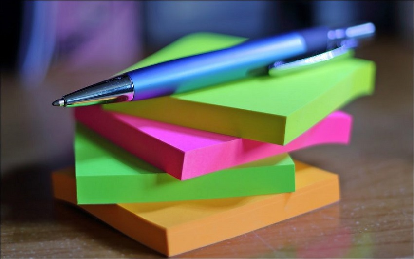 close-up of sticky notes and pen