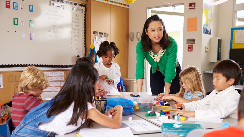 close-up of teacher engaging with students