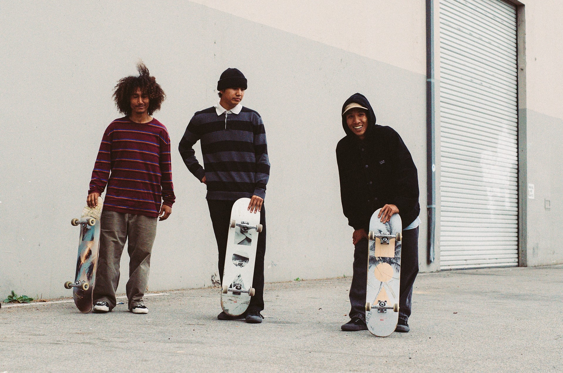 3 skaters posing for picture