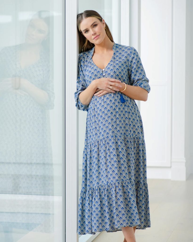 woman wearing blue breastfeeding dress