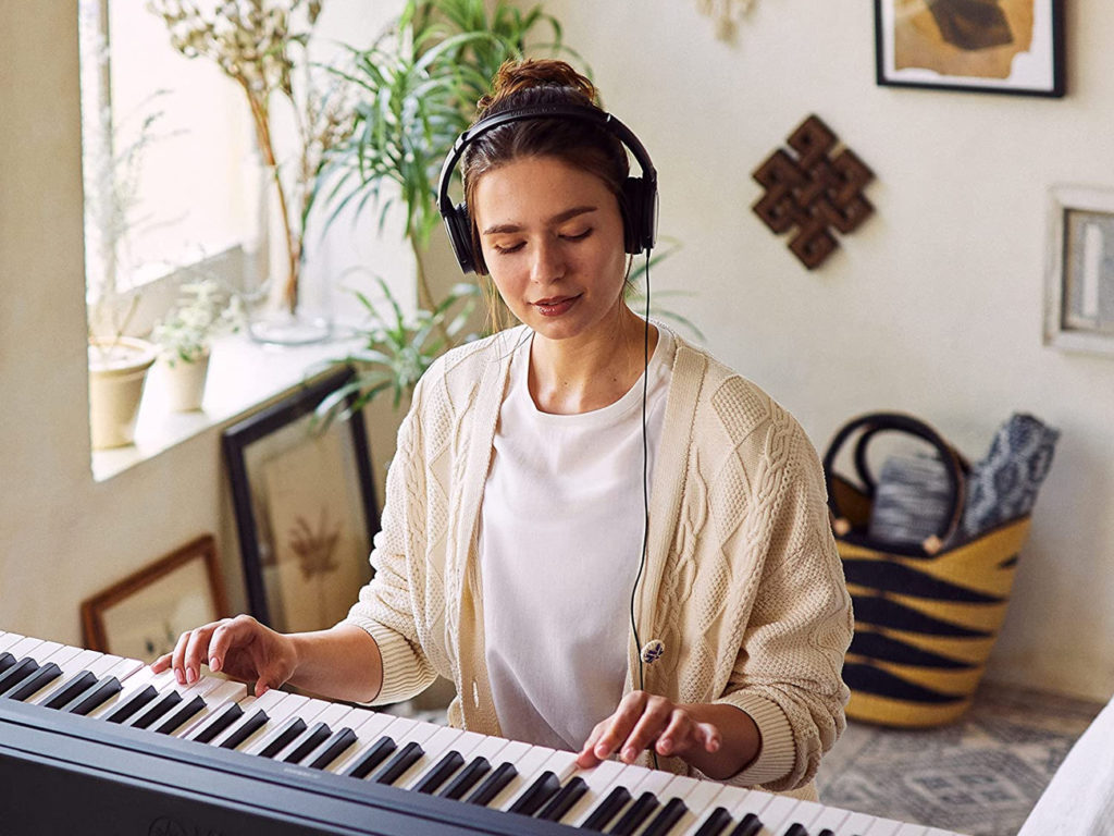 girl playing on Electronic Keyboard 